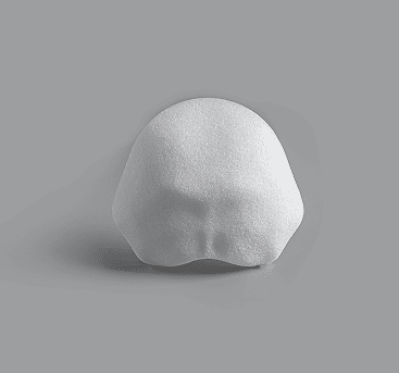 Curved white implant shaped for back of skull reconstruction