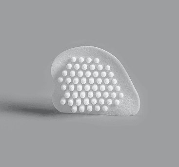 Curved white implant with grid pattern for temporal area